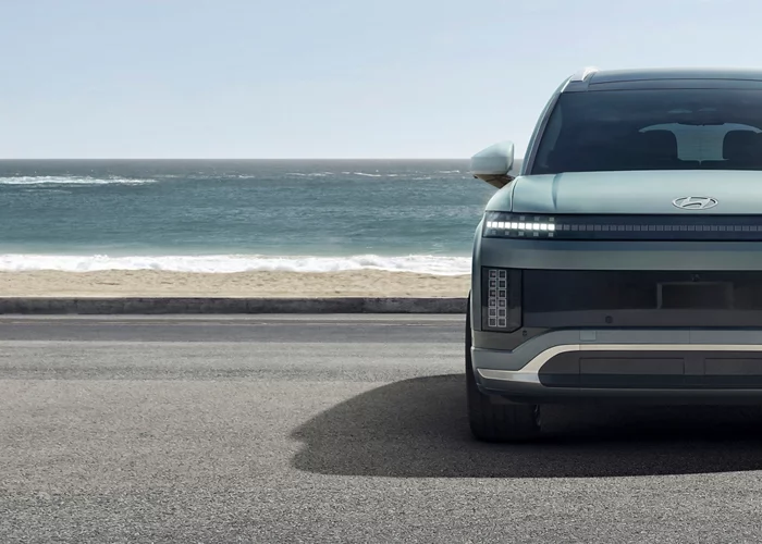 2026 hyundai ioniq 9 front view with car in front of the beach