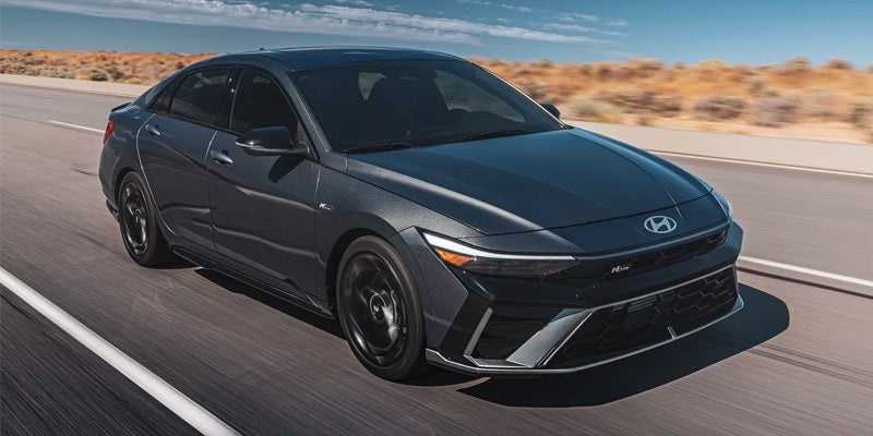 2026 Hyundai Elantra sedan driving on desert highway