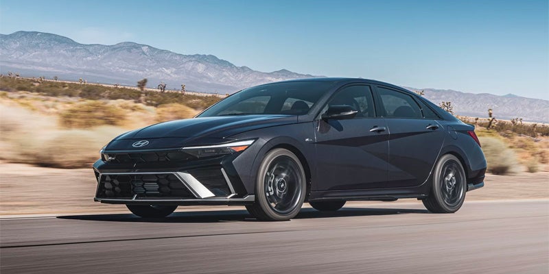 2026 Hyundai Elantra sedan driving on scenic highway