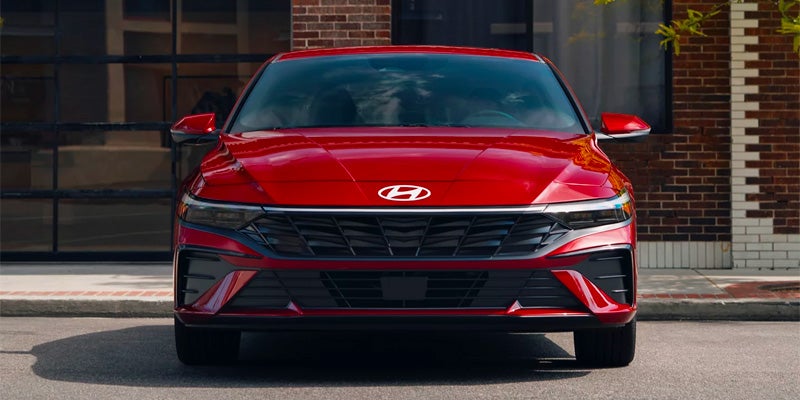 2026 Hyundai Elantra red sedan front view on city street