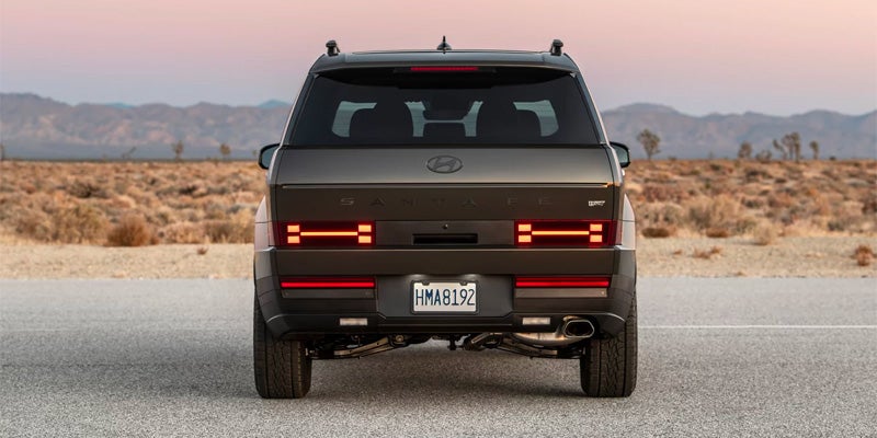 2026 Hyundai Santa Fe rear view parked in desert landscape