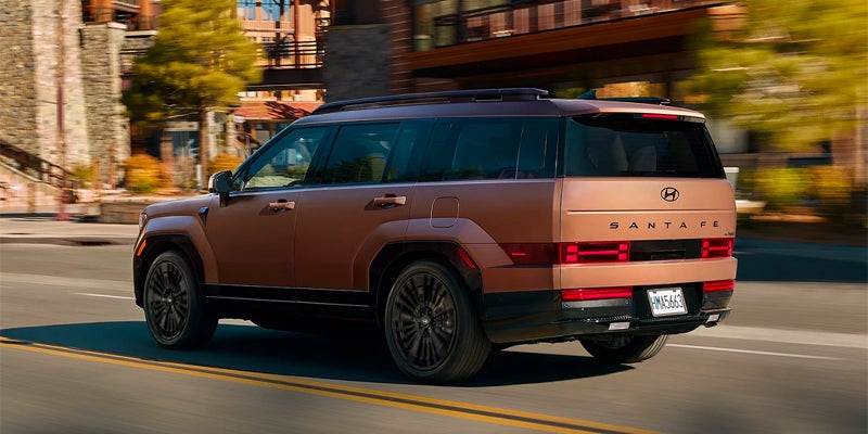 2026 Hyundai Santa Fe SUV driving through city streets