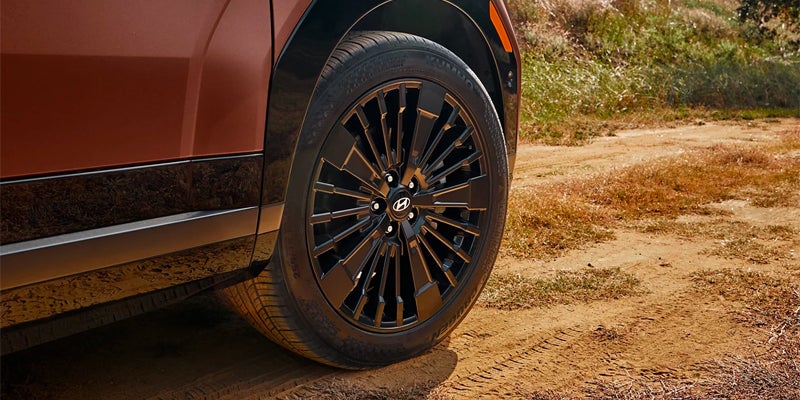 2026 Hyundai Santa Fe wheel and tire detail on dirt trail