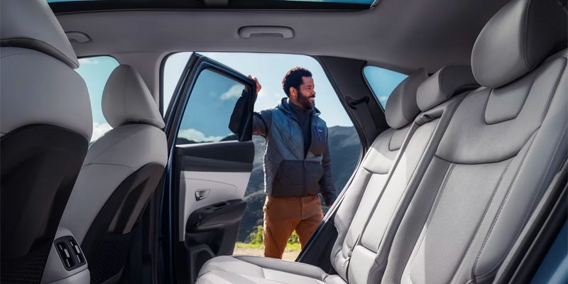 Hyundai Tucson interior with spacious rear seating and passenger access.