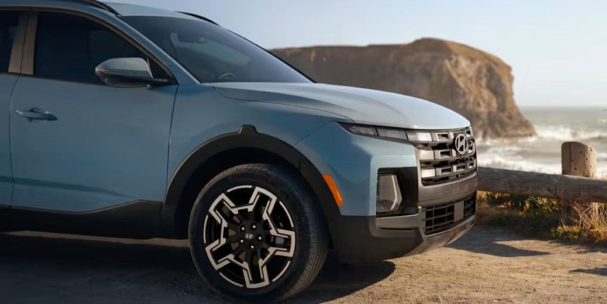 2025 Hyundai Santa Cruz parked near the beach, showcasing its sporty design and versatility.