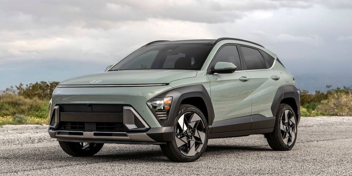 2025 Hyundai Kona parked on a gravel road with cloudy skies in the background.
