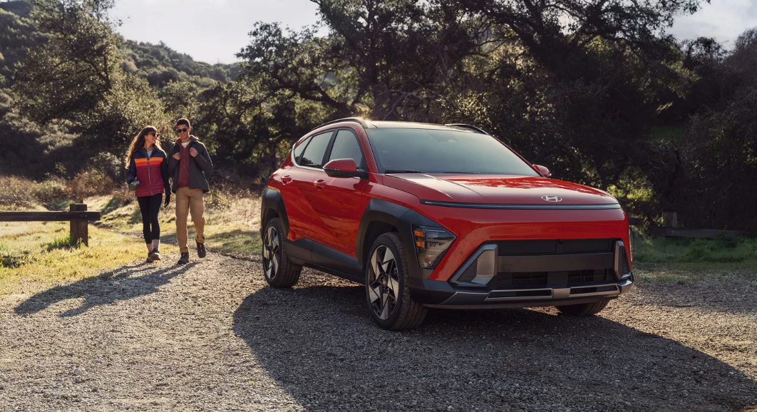 2026 Hyundai Kona driving on a scenic coastal road.