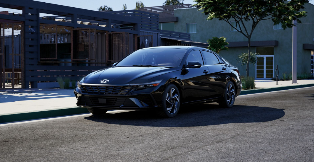 Black 2026 Hyundai Elantra parked outside of pizza resturant.